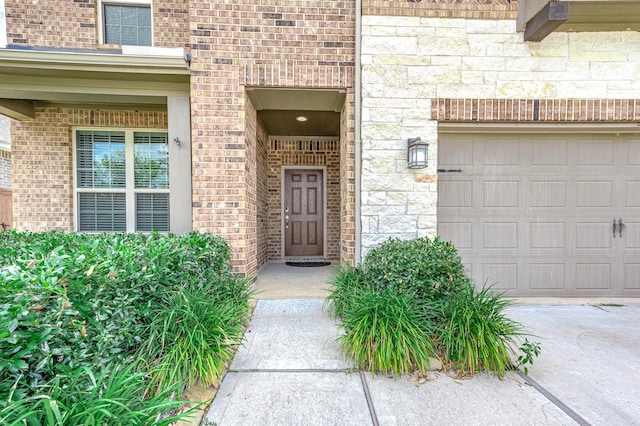 doorway to property featuring a garage