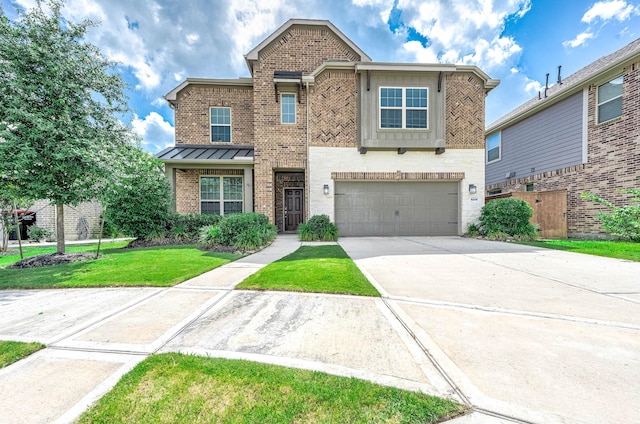 view of front of property featuring a front yard and a garage