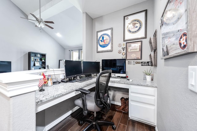 office area with dark hardwood / wood-style floors, ceiling fan, built in desk, and lofted ceiling