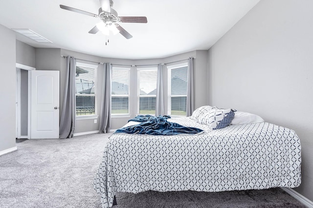 carpeted bedroom featuring ceiling fan