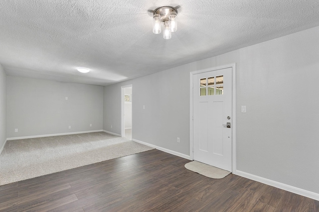 foyer featuring hardwood / wood-style floors and a textured ceiling