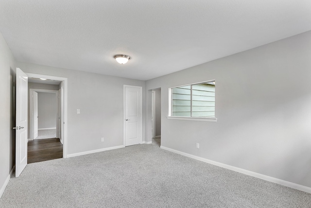 empty room with carpet flooring