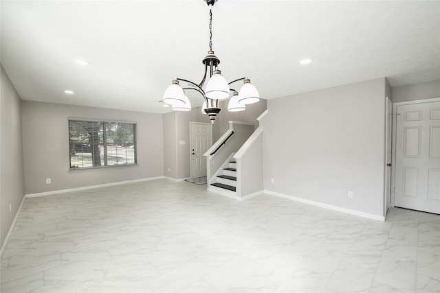 empty room featuring a chandelier