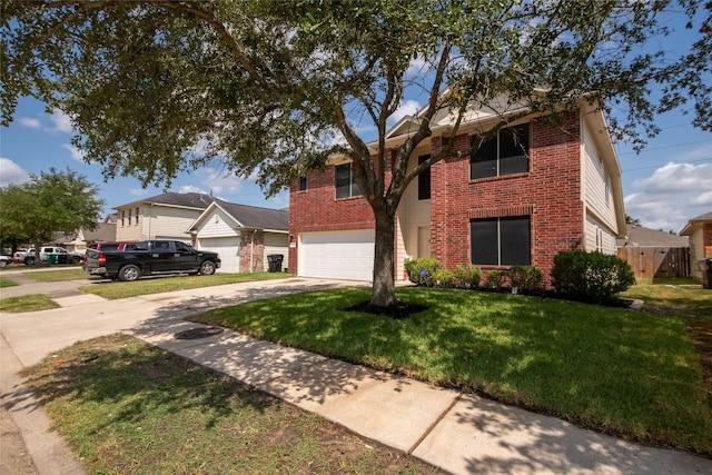 view of front of property with a garage and a front yard