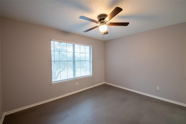 unfurnished room with a textured ceiling, ceiling fan, and dark hardwood / wood-style floors