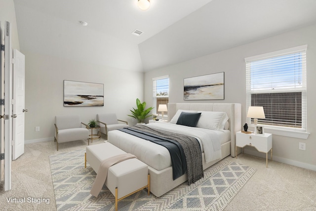 carpeted bedroom featuring vaulted ceiling and multiple windows