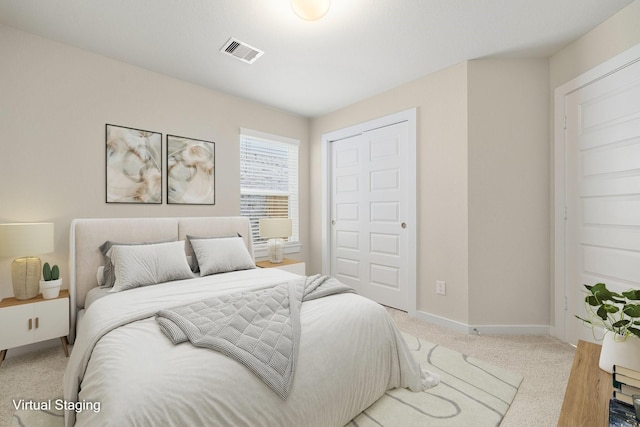 bedroom with light colored carpet and a closet