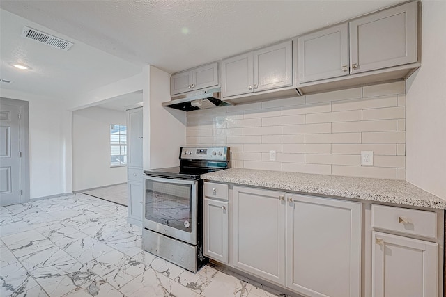 kitchen featuring stainless steel range with electric stovetop, light stone countertops, and backsplash