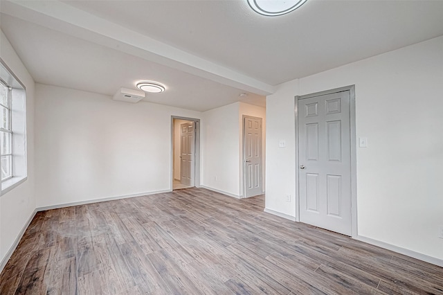 spare room featuring light hardwood / wood-style floors