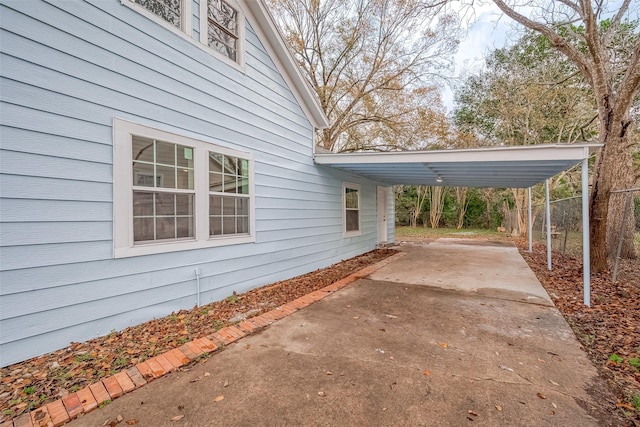 view of home's exterior featuring a carport