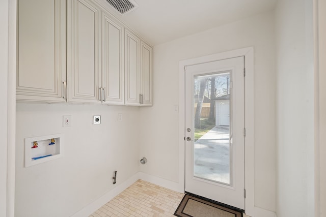 laundry room with electric dryer hookup, cabinets, washer hookup, and hookup for a gas dryer