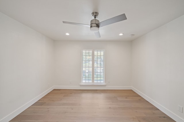 empty room with light hardwood / wood-style flooring and ceiling fan