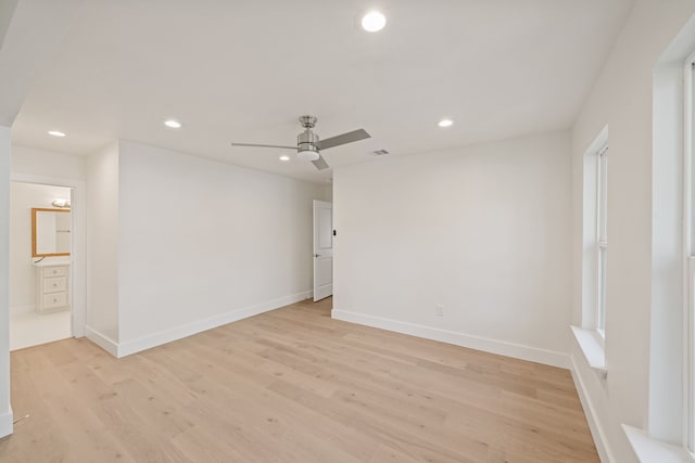 spare room with ceiling fan and light hardwood / wood-style floors