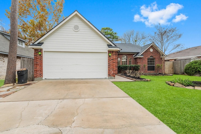 ranch-style house featuring a front yard and a garage