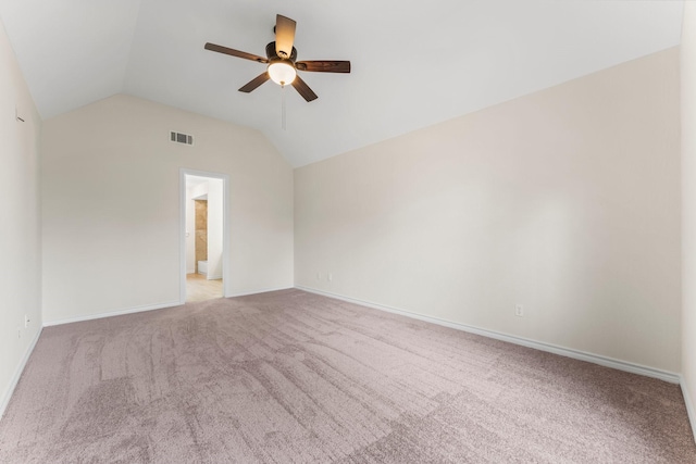 carpeted empty room featuring ceiling fan and lofted ceiling