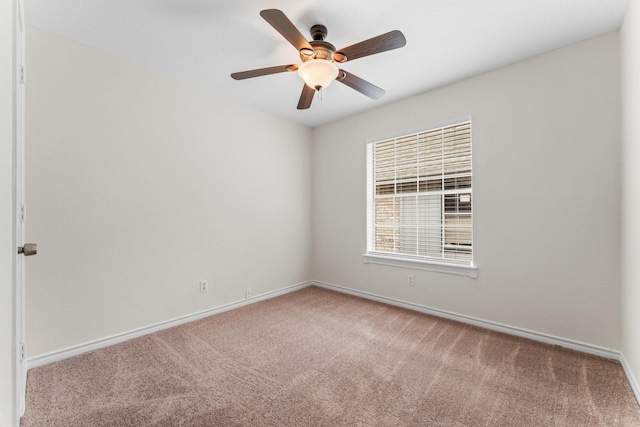 unfurnished room with carpet flooring and ceiling fan