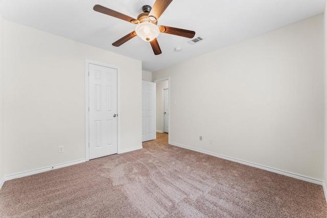 unfurnished bedroom featuring ceiling fan and light colored carpet