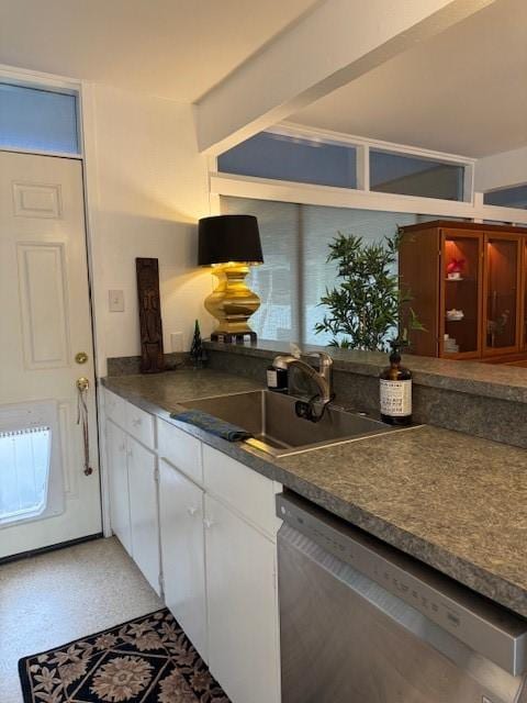 kitchen with white cabinetry, sink, and stainless steel dishwasher