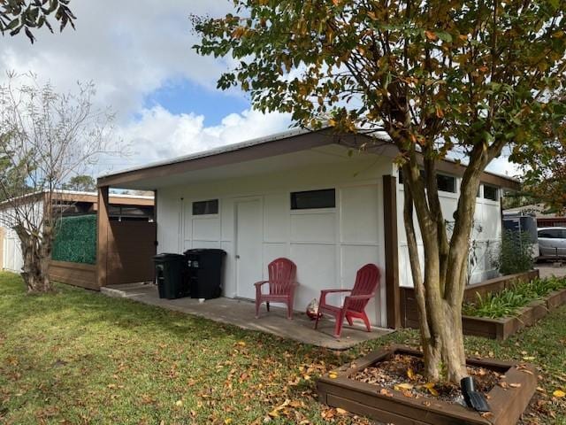 rear view of house featuring a yard