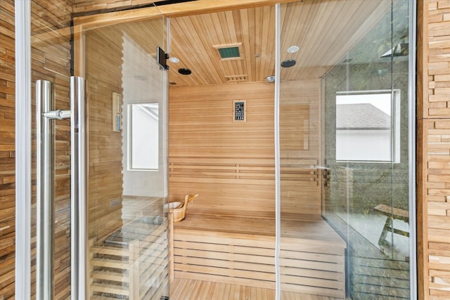 view of sauna / steam room featuring a wealth of natural light and hardwood / wood-style flooring