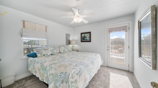 carpeted bedroom featuring access to exterior and ceiling fan