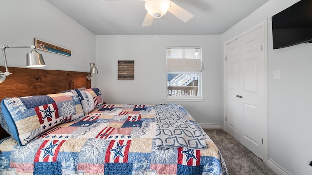 bedroom featuring ceiling fan, a closet, and carpet