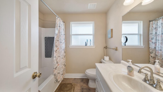 full bathroom with vanity, shower / bathtub combination with curtain, toilet, and a wealth of natural light