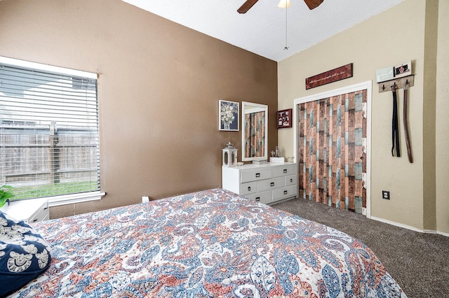 bedroom featuring carpet, vaulted ceiling, and ceiling fan