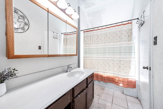 bathroom featuring tile patterned floors, vanity, and a shower with curtain