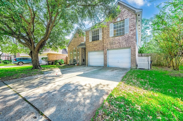 view of front of house featuring a front yard and a garage