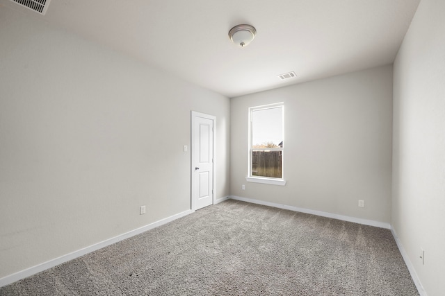 unfurnished room featuring carpet flooring