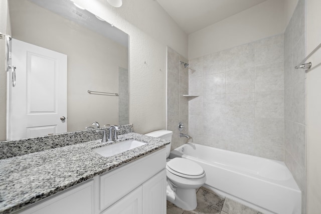 full bathroom featuring vanity, toilet, and tiled shower / bath