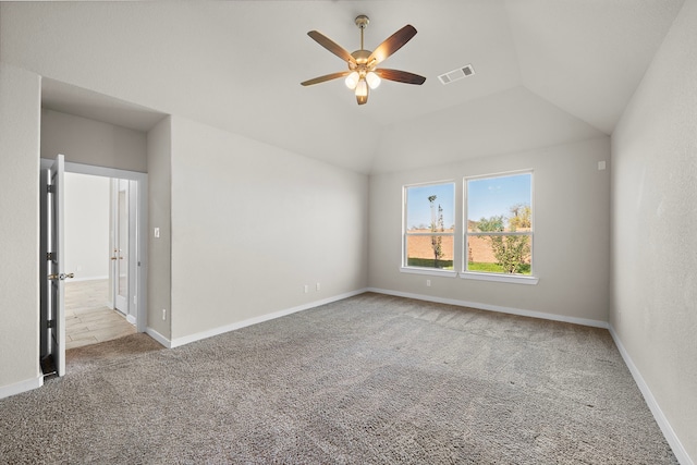 spare room with light carpet, ceiling fan, and lofted ceiling