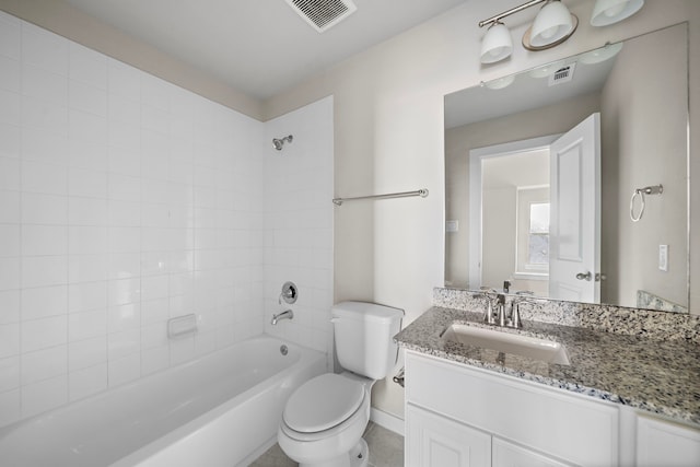 full bathroom featuring vanity, toilet, and tiled shower / bath combo