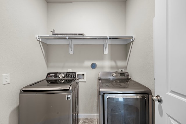 laundry room featuring separate washer and dryer