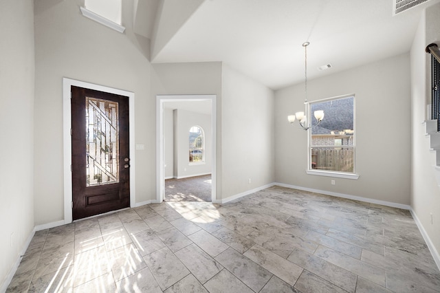 entrance foyer featuring a chandelier