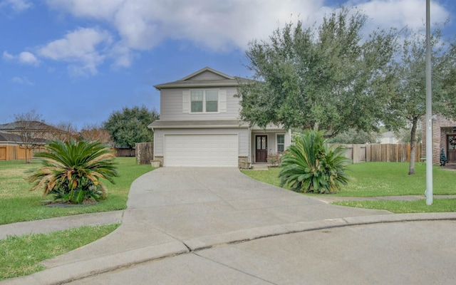 view of front of home featuring a front yard and a garage