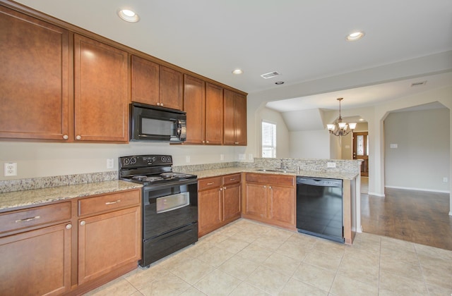 kitchen with sink, an inviting chandelier, vaulted ceiling, black appliances, and light wood-type flooring