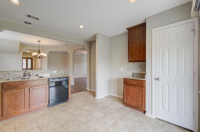 kitchen featuring dishwasher, light stone countertops, sink, and an inviting chandelier