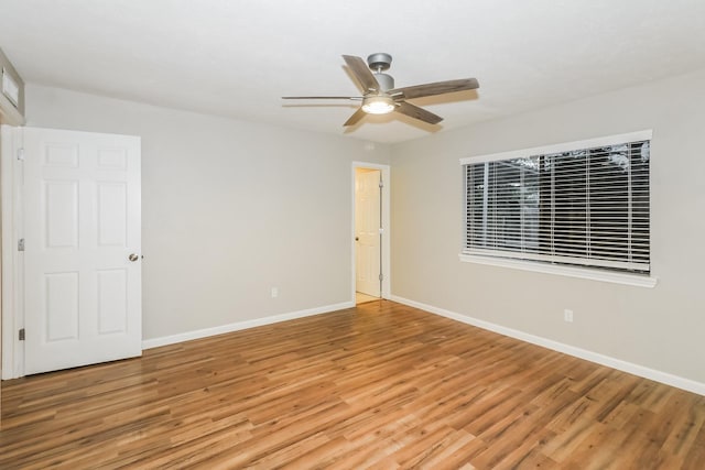 unfurnished room with ceiling fan and light hardwood / wood-style flooring