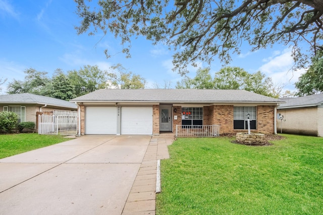 single story home featuring a garage and a front lawn