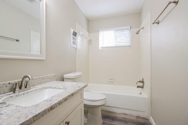 full bathroom featuring shower / tub combination, vanity, hardwood / wood-style flooring, and toilet