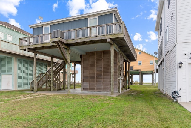 back of house with a yard and a wooden deck