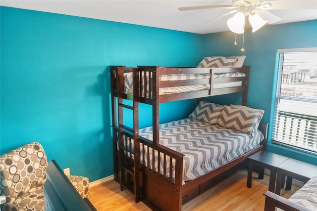 bedroom with ceiling fan, light hardwood / wood-style flooring, and breakfast area