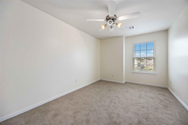 carpeted empty room with ceiling fan