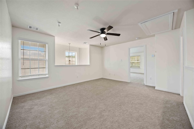 empty room with carpet flooring and ceiling fan