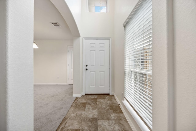 entrance foyer featuring carpet floors