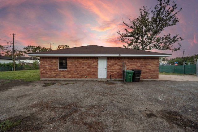 view of back house at dusk