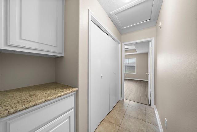 hallway with light tile patterned flooring