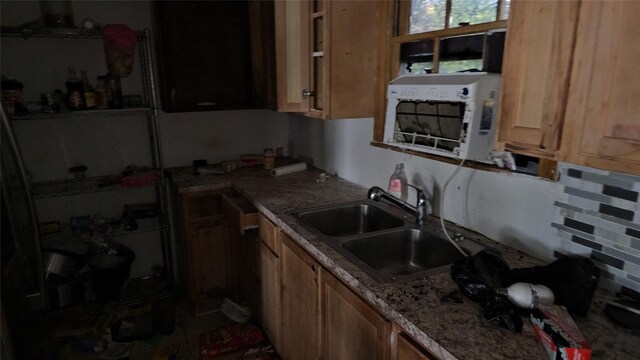 kitchen with decorative backsplash and sink